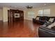 Spacious living room features an entertainment center, wood floors, and natural light at 15313 Hayworth Dr, Winter Garden, FL 34787