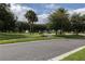 Scenic community park featuring lush green spaces, walking paths, and benches, perfect for relaxing and enjoying the outdoors at 15313 Hayworth Dr, Winter Garden, FL 34787