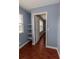 Walk-in closet with custom shelving and hardwood floors at 15313 Hayworth Dr, Winter Garden, FL 34787