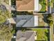 Aerial view of the home showcases a well-maintained roof, driveway, and fenced backyard at 15318 Beamleigh Rd, Winter Garden, FL 34787