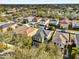 Aerial view of the home nestled among mature trees in a desirable neighborhood at 15318 Beamleigh Rd, Winter Garden, FL 34787