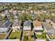 Overhead view of the neighborhood featuring lush trees, well-manicured lawns, and community streets at 15318 Beamleigh Rd, Winter Garden, FL 34787