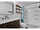 Modern bathroom featuring dark wood vanity, white countertop, and shower at 15318 Beamleigh Rd, Winter Garden, FL 34787