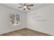 This bedroom features a ceiling fan, wood floors, and shelving at 15318 Beamleigh Rd, Winter Garden, FL 34787