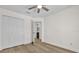 Bedroom boasts wood floors, ceiling fan, and closet at 15318 Beamleigh Rd, Winter Garden, FL 34787