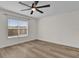 Bedroom features wood floors, a ceiling fan, and a window at 15318 Beamleigh Rd, Winter Garden, FL 34787