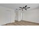 Bright bedroom featuring a closet, ceiling fan, and wood floors at 15318 Beamleigh Rd, Winter Garden, FL 34787