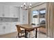 Dining area with modern lighting and an outdoor view at 15318 Beamleigh Rd, Winter Garden, FL 34787