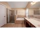 Bright bathroom featuring a walk-in shower, soaking tub, and double sink vanity at 15341 Urbino Ln, Orlando, FL 32828