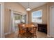 Cozy dining area with a round table and sliding door access to the outdoors at 15341 Urbino Ln, Orlando, FL 32828