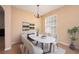 Elegant dining room with modern chandelier and ample natural light at 15341 Urbino Ln, Orlando, FL 32828