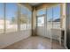 This sunroom offers floor-to-ceiling windows and a utility sink at 15341 Urbino Ln, Orlando, FL 32828