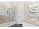 Modern bathroom featuring a glass shower with marble tile and granite countertop with stylish fixtures at 1595 Juniper Hammock St, Winter Garden, FL 34787