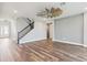 Inviting living room featuring wood floors, staircase, and entry way at 1595 Juniper Hammock St, Winter Garden, FL 34787