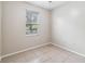 Well-lit bedroom with tiled floor and a bright open space at 18468 Sabal St, Orlando, FL 32833