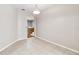 Bright dining room with tile floors, neutral paint, and an archway leading to the kitchen at 18468 Sabal St, Orlando, FL 32833