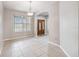 Spacious dining room with tile flooring, neutral paint, and an archway leading to the foyer at 18468 Sabal St, Orlando, FL 32833