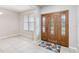 Welcoming foyer with a decorative front door, tile flooring, and a neutral color palette at 18468 Sabal St, Orlando, FL 32833