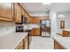 Bright kitchen with wooden cabinetry, stainless steel appliances, and open space concept at 18468 Sabal St, Orlando, FL 32833