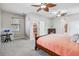 Main bedroom featuring carpet floors, ceiling fans, natural light, and cozy furniture at 18468 Sabal St, Orlando, FL 32833