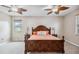 Main bedroom featuring carpet floors, ceiling fans, natural light, and cozy furniture at 18468 Sabal St, Orlando, FL 32833