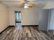 Bright living room with wood-look floors and a ceiling fan fixture at 18541 15Th Ave, Orlando, FL 32833