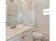 Bright bathroom featuring white subway tile, a sink with vanity and a shower-tub combo at 2021 Canal Rd, Deltona, FL 32738