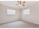 Bright bedroom with two windows and a ceiling fan, showcasing a cozy atmosphere at 2021 Canal Rd, Deltona, FL 32738