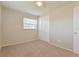 Neutral bedroom with light beige carpet, a window with blinds, and a ceiling fan at 2021 Canal Rd, Deltona, FL 32738