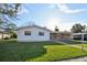 Charming single-story home with a well-maintained lawn and a brick accent wall at 2021 Canal Rd, Deltona, FL 32738