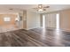 Spacious living room featuring modern gray flooring and a bright, open layout at 2021 Canal Rd, Deltona, FL 32738