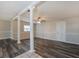 Inviting living room showcasing decorative pillars, gray floors, and neutral walls at 2021 Canal Rd, Deltona, FL 32738