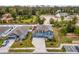 Aerial view of a charming blue home with a three car garage and a neatly landscaped front yard at 2067 Buckhanon Trl, Deland, FL 32720