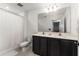 Well-lit bathroom with double vanity and a shower with curtain at 2067 Buckhanon Trl, Deland, FL 32720