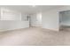 Neutral carpeted upstairs loft with ample open space and natural light at 2067 Buckhanon Trl, Deland, FL 32720