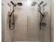 Modern bathroom shower featuring dual shower heads and tiled walls at 2067 Buckhanon Trl, Deland, FL 32720