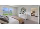 Bright bedroom with a large window and decorative mirror above a modern dresser at 2149 Pigeon Plum Dr, Haines City, FL 33844