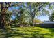 Fenced backyard featuring mature trees providing plenty of shade at 2401 S Myrtle Ave, Sanford, FL 32771