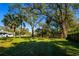 Beautiful backyard with mature trees, providing plenty of shade and space for outdoor enjoyment at 2401 S Myrtle Ave, Sanford, FL 32771