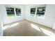 Bright bedroom with new carpet, large windows and natural light at 2401 S Myrtle Ave, Sanford, FL 32771