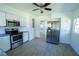 Well-lit kitchen featuring stainless steel appliances, granite countertops, and white cabinetry at 2401 S Myrtle Ave, Sanford, FL 32771