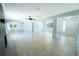 Bright and airy living room with modern light fixtures, wood look flooring, and a decorative fireplace at 2401 S Myrtle Ave, Sanford, FL 32771