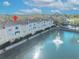 An aerial view of townhouses on a pond with fountain at 2425 Legacy Lake Dr # 2425, Maitland, FL 32751