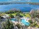 A landscaped pool with a lake in the background at 2425 Legacy Lake Dr # 2425, Maitland, FL 32751