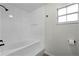 Clean bathroom features a bathtub and shower combination with a tiled surround at 2751 Carmel Ct, Kissimmee, FL 34746