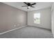 Empty bedroom featuring neutral walls, large windows and closet at 2751 Carmel Ct, Kissimmee, FL 34746