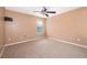 Cozy bedroom featuring neutral carpet, ceiling fan, and a window for natural light at 2753 Joseph Cir, Oviedo, FL 32765