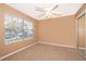 Cozy bedroom with neutral carpet, ceiling fan, and natural light from window at 2753 Joseph Cir, Oviedo, FL 32765