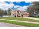 Charming two-story stucco home with well-manicured lawn and attached two-car garage in a suburban neighborhood at 2753 Joseph Cir, Oviedo, FL 32765