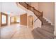 Inviting foyer with tile flooring, staircase, and view into the dining and living areas at 2753 Joseph Cir, Oviedo, FL 32765